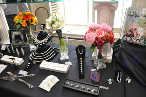Flowers with Sussex County Florist share a table with baubles from D'Andrea's Jewelers.