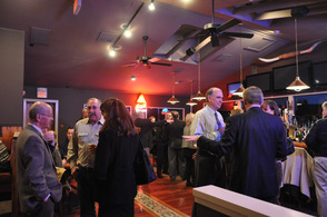 Chamber members socialize in the bar area of Down to the Bone Barbecue & Company, at their most recent Business After Hours.