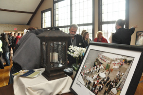Larry Patton of the Lake Mohawk Country Club shows a bride and groom-to-be photos of the Lake Mohawk Country Club.