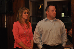 Kim and Mike Strada listen as Glen Vetrano speaks.