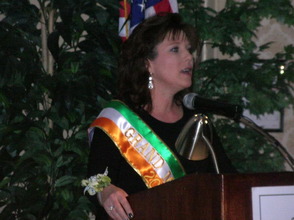 Dawn Delaney, one of the 2013 Parade Grand Marshals, at the podium.