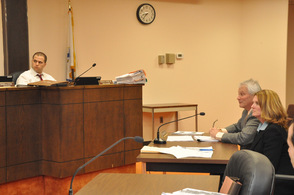 Jessica Caldwell and Stuart Koperweis present their plan to the town council, as Town of Newton Town Manager Thomas S. Russo, Jr., listens intently.