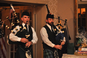 Pipers escort the grand marshals and flag bearers in