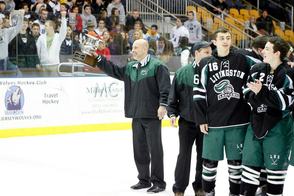 Coach Dave Conklin Holding the McInnis Cup