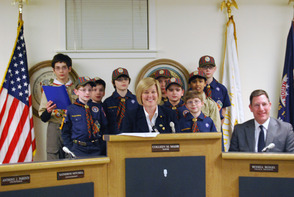The Weblos Cub Scouts Pack 98 opened the meeting and led the Pledge of Allegiance. The eight 4th graders were working on earning their citizen badges.
