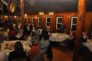 Tables line up all sides of the room with supporters.