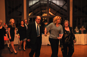 2013 Grand Marshals John and Sue Sullivan, and Dawn Delaney, and their families, march in.