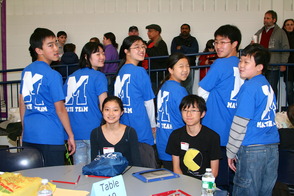 The team models their Math Team T-shirts.