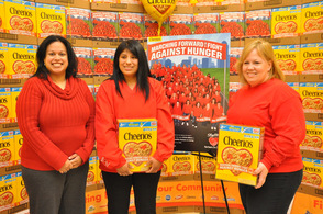 Byram Councilwoman Nisha Kash poses with Denise Lewis and Jennifer Wilson of the Byram Store each hold a Cheerios Box, in which they are featured in a photo on back.