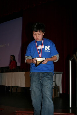 Andy Chen receives his second place award.  Andy moved up from 5th to 2nd place in an exciting countdown round that had the audience gasping in amazement.