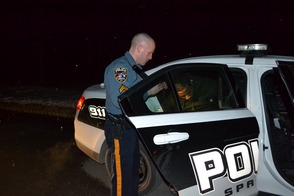 Cpl. Marc Rubino secures gang member Courry Rice in the rear of his patrol vehicle.  Rice’s bail was set at $200,000.00 without a 10% option.