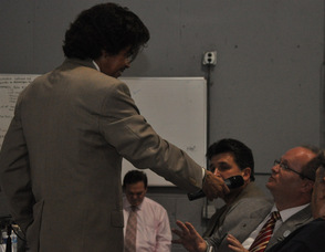 Al Cole engages members of the audience including Patrick Kitson Robinson, of SMART Air Fuel Saver, LLC in Pennsylvania.