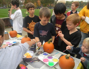 kids painting pumpkins