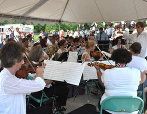 The New Sussex Symphony and the Newton High School Band play the "Armed Forces Salute". 
