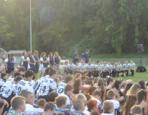 Players listen to the speakers.