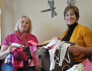 Dawn Gomez (right), with her mother Laura Gomez (left), and some of the brassieres collected for Be a Dear and Donate a Brassiere.