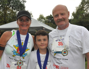 Renae, Dane (age 10), and Keith Armstrong, in their third 5K as a family.