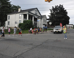 The group crosses Trinity Street to Union Place.