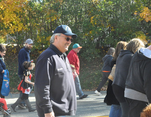 Councilman Rich Bunce smiles as he walks in the parade.