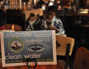 A sign about the fundraiser in the restaurant.