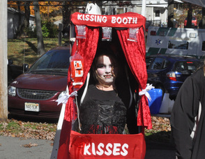 Alyia Puluse, age 10, as a vampiress in a kissing booth.