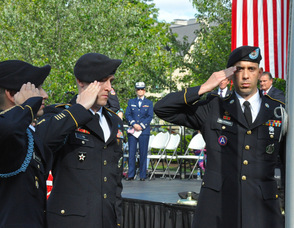 Matthew D. Neuenfeldt, John Flynn, and Juan Maldonado raise the American Flag.