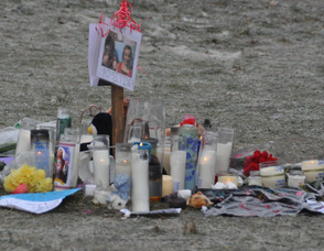 Candles still burn early today in memory today of the two boys, as well as a photo of Schimanski, and his girlfriend Shelby LaBar, with a message, "Stay Positive."