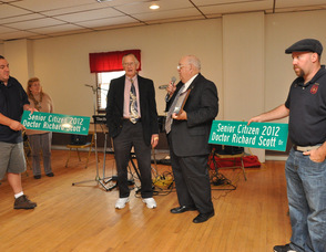 Dr. Richard Scott with Mayor Paul Crowley, flanked by Joe Limon, and, Fred Babcock, who hold the street signs.