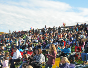 The crowd is fixated on the rodeo.