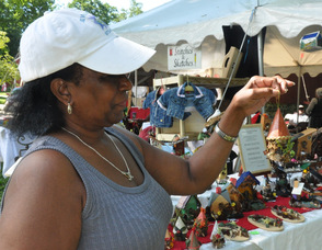 Jewel Brown of Jewel Gems holds up one of her "Tweets".