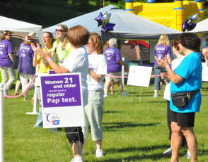 Spectators cheer on the survivors.