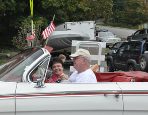 Ogdensburg Borough Administrator Phyllis Drouin smiles and waves to the crowd. 