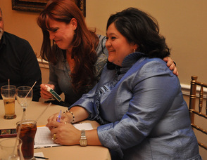 A supporter puts their arm around Helen Le Frois.