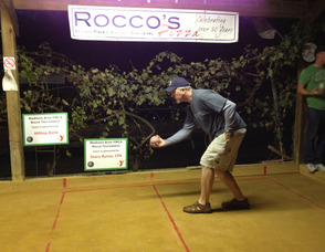 Rich Lehmann rolls at the Forum Club bocce court