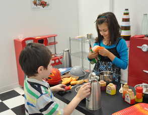 Ryan Hudock, age 6, of Newton, plays in the "diner" with cousin Gabrielle Drewsky, age 7, of South Plainfield, N.J.