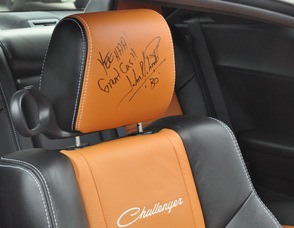 John Schneider's autograph on a General Lee's seat.
