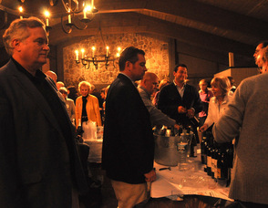 George Graham, Bob O'Gureck of R&R Marketing, and James Oscovitch, pour wine for the guests.
