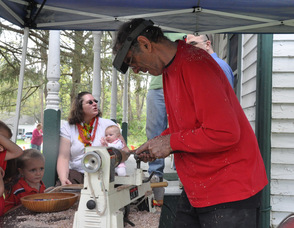 A woodturning demonstration, where a child's toy top was created.