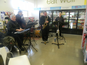 A band performing at the grand opening