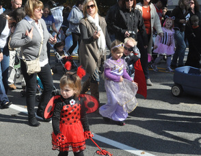 A little ladybug marches in the parade.