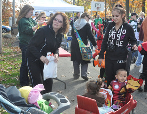 The youngest parade participants pick up their goody bags.