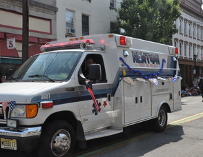 Newton First Aid Squad drives along Spring Street.
