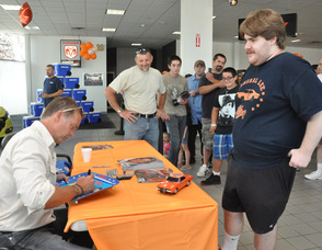 John Schneider signs a "Dukes of Hazzard" tray.