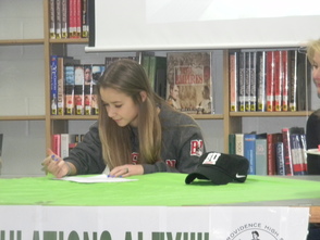 Alex Schlobohm signing her letter of intent to play soccer at Boston University