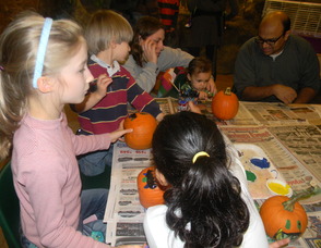 kids painting pumpkins