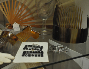 Elegant hair combs and shoe buckles are on display alongside of the Cooper Family Bible at the museum.