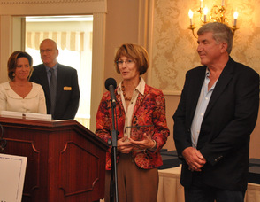 Cate and Tom Roberts of Tamarack's Country Villa accept the New Business Award.