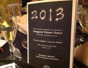 The evening's program sitting on one of the tables at the night's event.