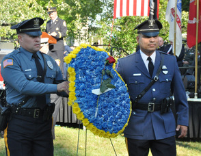 Ptl. Steve VanNieuwland of the Newton Police Department, and Pt. Victor Marin of Byram Township Police, carry the Police Wreath.