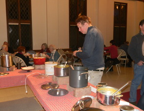 People sampling soup